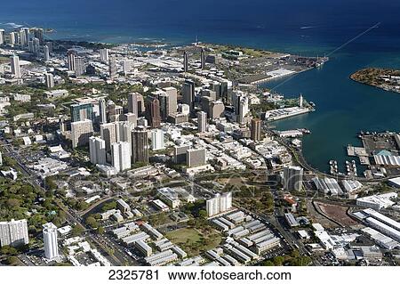 Stock Image - Aerial view of an hawaiian city on the coast; Hawaii, United States of America. Fotosearch