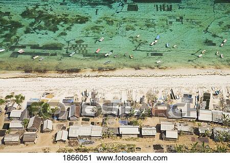 Stock Image - Aerial View Of Carrageenan Seaweed Harvesting Village On The Bukit Peninsula Of Bali, Indonesia. Fotosearch