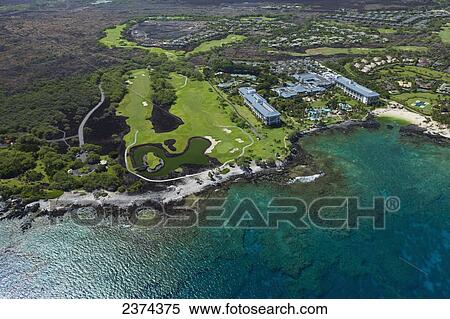Stock Photography - Aerial view of Fairmont Orchid Hotel and Mauna Lani Golf Course; Big Island, Hawaii, United States of America. Fotosearch