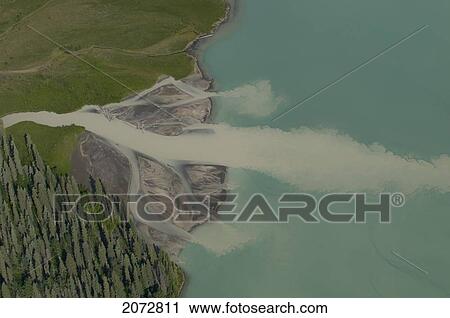 Aerial View Of Glacial Creek Flowing Into Green Waters Of Glacier Lake, Nahanni National Park, Northwest Territories View Large Photo Image Stock Image - Aerial View Of Glacial Creek Flowing Into Green Waters Of Glacier Lake, Nahanni National Park, Northwest Territories. Fotosearch