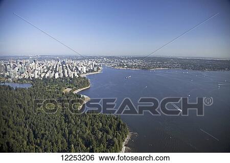 Stock Photograph - Aerial view of Lost Lagoon, Stanley Park and downtown; Vancouver, British Columbia, Canada. Fotosearch