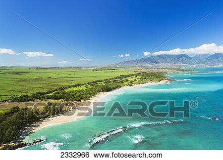 Stock Photograph - Aerial view of Paia and Kuau towns, and Haleakala in background; Maui, Hawaii, United States of America. Fotosearch