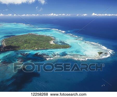 Stock Photo - Aerial view of small Samoan island between Upolu and Savaii; Samoa. Fotosearch