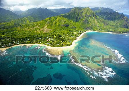 Stock Image - Aerial view of the coastline of an hawaiian island; Na Pali coast of Kauai, Hawaii, United States of America. Fotosearch