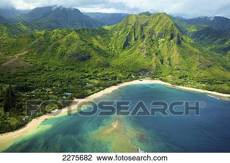 Stock Image - Aerial view of the coastline of an hawaiian island; Na Pali coast of Kauai, Hawaii, United States of America. Fotosearch