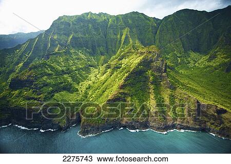 Aerial view of the coastline of an hawaiian island; Na Pali coast of Kauai, Hawaii, United States of America View Large Photo Image Stock Image - Aerial view of the coastline of an hawaiian island; Na Pali coast of Kauai, Hawaii, United States of America. Fotosearch