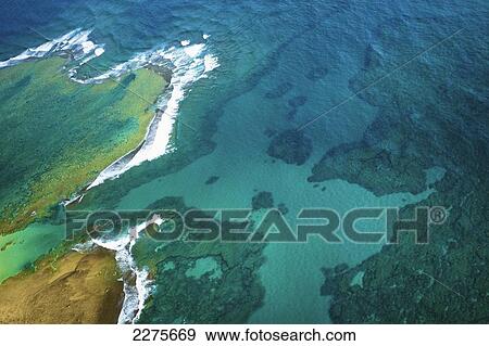 Aerial view of the coastline of an hawaiian island; Na Pali coast of Kauai, Hawaii, United States of America View Large Photo Image Stock Photo - Aerial view of the coastline of an hawaiian island; Na Pali coast of Kauai, Hawaii, United States of America. Fotosearch