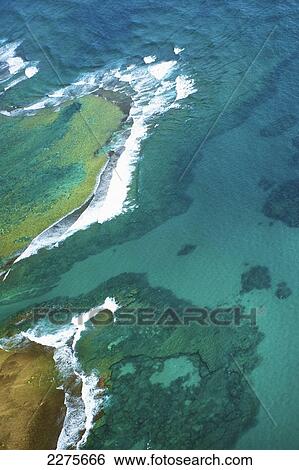 Aerial view of the coastline of an hawaiian island; Na Pali coast of Kauai, Hawaii, United States of America View Large Photo Image Stock Photograph - Aerial view of the coastline of an hawaiian island; Na Pali coast of Kauai, Hawaii, United States of America. Fotosearch