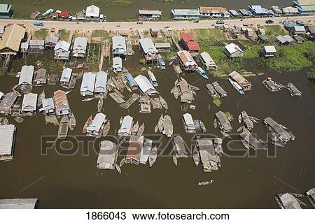Stock Image - Aerial View Of The Floating Village Of Chong Kneas Bordering The Tonle Sap Lake In Cambodia. Fotosearch