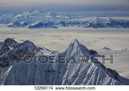 Aerial view of the mountains and icefields in Kluane National Park; Yukon, Canada View Large Photo Image Picture - Aerial view of the mountains and icefields in Kluane National Park; Yukon, Canada. Fotosearch