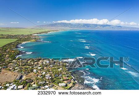 Stock Image - Aerial view of the North shore coastline, Paia and Kuau towns; Maui, Hawaii, United States of America. Fotosearch
