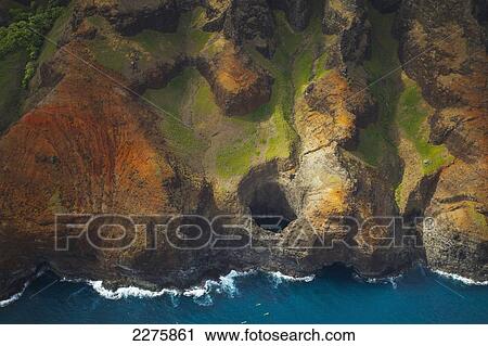 Aerial view of the rugged coastline along a hawaiian island, Na Pali coast; Kauai, Hawaii, United States of America View Large Photo Image Stock Image - Aerial view of the rugged coastline along a hawaiian island, Na Pali coast; Kauai, Hawaii, United States of America. Fotosearch