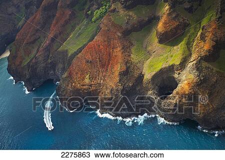 Aerial view of the rugged coastline along a hawaiian island, Na Pali coast; Kauai, Hawaii, United States of America View Large Photo Image Stock Image - Aerial view of the rugged coastline along a hawaiian island, Na Pali coast; Kauai, Hawaii, United States of America. Fotosearch