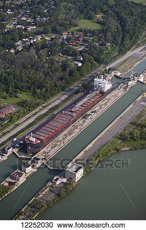 Aerial view of the Welland Canal and a ship in a canal lock; Thorold, Ontario, Canada View Large Photo Image Stock Image - Aerial view of the Welland Canal and a ship in a canal lock; Thorold, Ontario, Canada. Fotosearch
