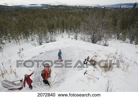 Aerial View Of Three Sisters Skating On Backyard Pond In Winter, Whitehorse, Yukon View Large Photo Image Stock Image - Aerial View Of Three Sisters Skating On Backyard Pond In Winter, Whitehorse, Yukon. Fotosearch