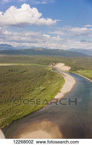 Stock Image - Aerial view of tundra covered sandbars and the Kobuk River with Baird Mountains in the background, Arctic Alaska, summer. Fotosearch
