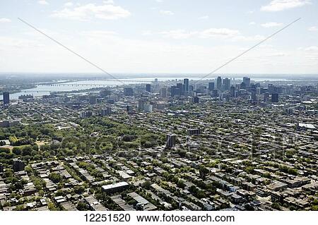 Aerial view of urban skyline and Saint Lawrence River; Montreal, Quebec, Canada View Large Photo Image Stock Image - Aerial view of urban skyline and Saint Lawrence River; Montreal, Quebec, Canada. Fotosearch