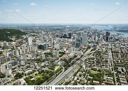 Stock Image - Aerial view of urban skyline and Saint Lawrence River; Montreal, Quebec, Canada. Fotosearch