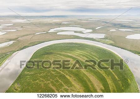 Stock Photography - Aerial view of wetlands and lakes along the Kobuk River, Arctic Alaska, summer. Fotosearch