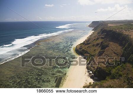 Aerial View Over The Cliffs, Reefs And Beaches Of The Bukit Peninsula Of Bali; Bali, Indonesia View Large Photo Image Stock Photography - Aerial View Over The Cliffs, Reefs And Beaches Of The Bukit Peninsula Of Bali; Bali, Indonesia. Fotosearch