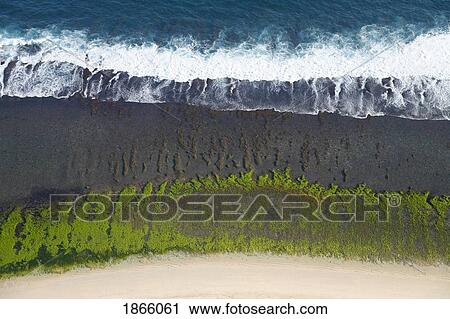 Stock Image - Aerial View Over The Reefs And Beaches Of The Bukit Peninsula Of Bali, Indonesia. Fotosearch