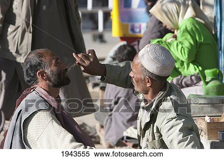 Stock Photography - Afghan Barber In Charikar, Parwan Province, Afghanistan. Fotosearch