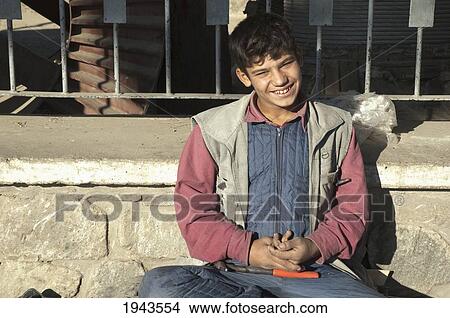 Picture - Afghan Boy At The Bazaar In Charikar, Parwan Province, Afghanistan. Fotosearch