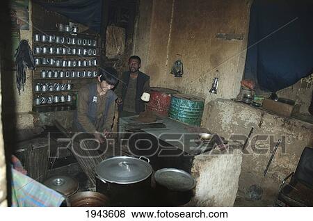 Stock Photo - Afghan Boy Preparing Kebabs Restaurant In Gardandiwal (Dane Sia Sang), Vardak Province, Afghanistan. Fotosearch