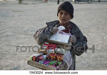 Picture - Afghan Boy Selling Cigarettes And Candy On The Tapa Maranjan Ridge In Kabul,, Afghanistan. Fotosearch