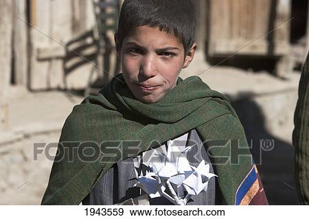 Afghan Boy With Paper Flower In Chahar Deh-Ye Ghowr Band, Parwan Province, Afghanistan View Large Photo Image Stock Photo - Afghan Boy With Paper Flower In Chahar Deh-Ye Ghowr Band, Parwan Province, Afghanistan. Fotosearch