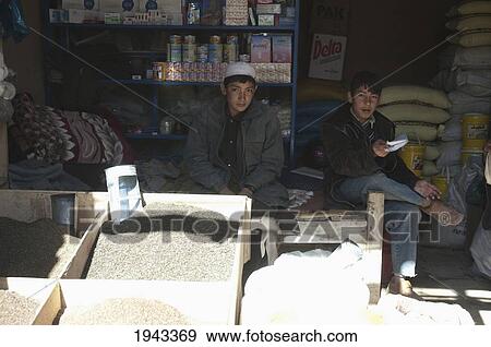 Afghan Boys In A Food Store At The Bazaar In Bamiyan, Bamian Province, Afghanistan View Large Photo Image Stock Photo - Afghan Boys In A Food Store At The Bazaar In Bamiyan, Bamian Province, Afghanistan. Fotosearch