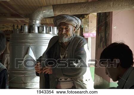 Afghan Doctor Dispensing Medicines At A Restaurant In Bamiyan, Bamian Province, Afghanistan View Large Photo Image Picture - Afghan Doctor Dispensing Medicines At A Restaurant In Bamiyan, Bamian Province, Afghanistan. Fotosearch