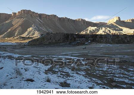 Stock Image - Afghan Farmers And Their Donkeys Leaving A Gristmill By Band-I-Haibat (Dam Of Awe), Band-I-Amir, Bamian Province, Afghanistan. Fotosearch