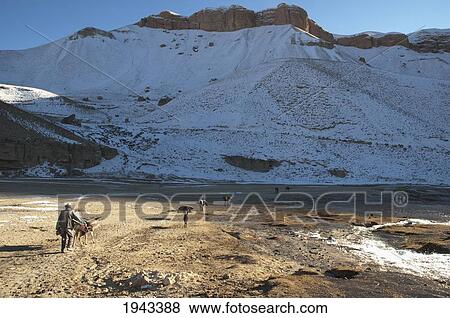 Stock Photo - Afghan Farmers And Their Donkeys Leaving A Gristmill By Band-I-Haibat (Dam Of Awe), Band-I-Amir, Bamian Province, Afghanistan. Fotosearch