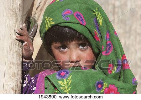 Stock Image - Afghan Girl In Shekh Ali, Parwan Province, Afghanistan. Fotosearch