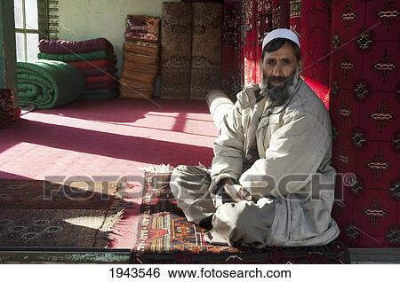 Stock Photograph - Afghan Man At A Carpet Store In Charikar, Parwan Province, Afghanistan. Fotosearch