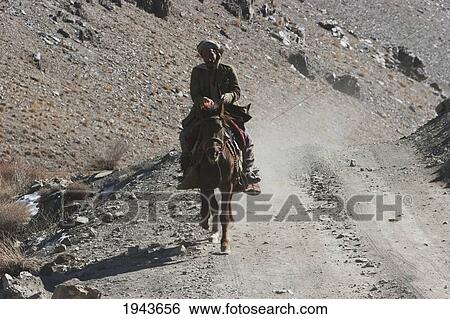Afghan Man On Horseback Near Zarkharid, Vardak Province, Afghanistan View Large Photo Image Stock Photograph - Afghan Man On Horseback Near Zarkharid, Vardak Province, Afghanistan. Fotosearch