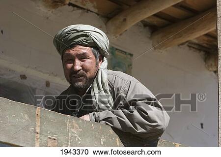 Afghan Man On The Balcony Of A Teahouse In Bamiyan, Bamian Province, Afghanistan View Large Photo Image Stock Image - Afghan Man On The Balcony Of A Teahouse In Bamiyan, Bamian Province, Afghanistan. Fotosearch