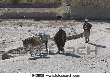 Stock Photography - Afghan Men And Donkeys In The Siagerd Valley, Parwan Province, Afghanistan. Fotosearch