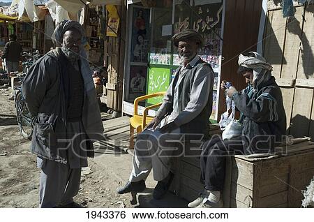 Afghan Men At The Bazaar In Bamiyan, Bamian Province, Afghanistan View Large Photo Image Stock Photograph - Afghan Men At The Bazaar In Bamiyan, Bamian Province, Afghanistan. Fotosearch