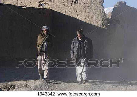 Afghan Men On A Dusty Road In Bamiyan, Bamian Province, Afghanistan View Large Photo Image Stock Image - Afghan Men On A Dusty Road In Bamiyan, Bamian Province, Afghanistan. Fotosearch