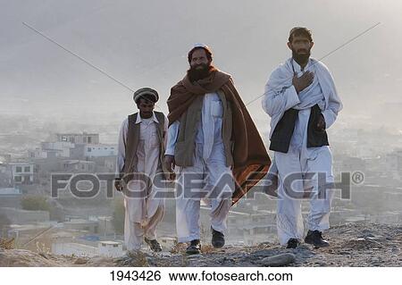 Stock Photograph - Afghan Men On The Tapa Maranjan Ridge In Kabul,, Afghanistan. Fotosearch
