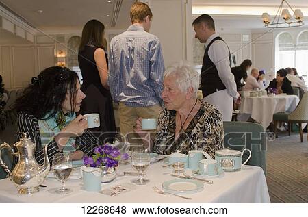 Stock Photo - Afternoon tea at Fortnum and Mason; Piccadilly, London, England. Fotosearch