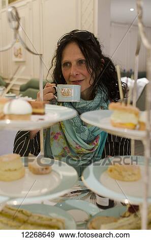Stock Photo - Afternoon tea at Fortnum and Mason; Piccadilly, London, England. Fotosearch
