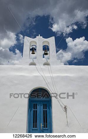 Stock Photograph - Aghios Ioannis on a cliff above above Apokofto Bay in Southeastern Sifnos; Sifnos, Cyclades, Greek Islands, Greece. Fotosearch