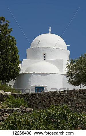 Stock Photo - Agios Ionnis, a white washed church surrounded by stone walls in Southeastern Sifnos; Sifnos, Cyclades, Greek Islands, Greece. Fotosearch