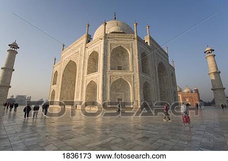 Stock Image - Agra, India; Tourists Walking The Square At Taj Mahal. Fotosearch