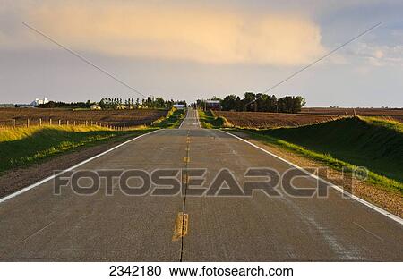 Agriculture - Crisp sunlight defines a rural country road and surrounding countryside after a spring storm has passed through / Central Iowa, USA. View Large Photo Image Stock Image - Agriculture - Crisp sunlight defines a rural country road and surrounding countryside after a spring storm has passed through / Central Iowa, USA.. Fotosearch