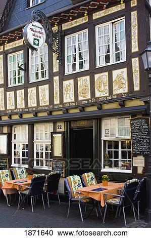 Stock Image - Ahrweiler, Nordrhein-Westfalen, Germany; Outdoor Seating On A Restaurant Patio. Fotosearch