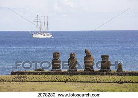 Stock Image - Ahu Vai Ure At The Tahai Ceremonial Complex Tahai Was Restored By Mulloy And Ayres; Chilean Navy Training Ship Esmeralda In The Background, Rapa Nui. Fotosearch